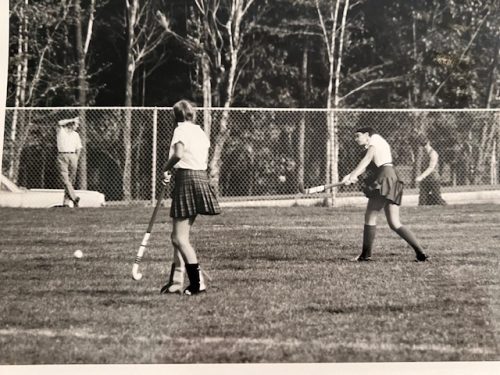 Diane playing field hockey